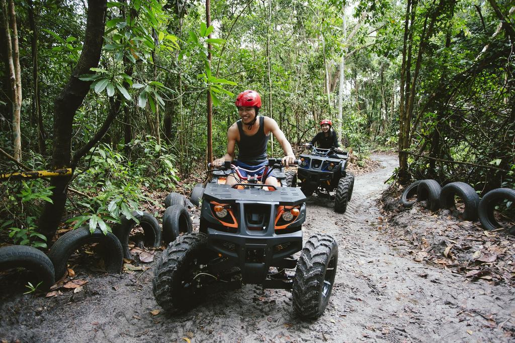 Sand & Sandals Desaru Beach Resort & Spa Dış mekan fotoğraf ATV riding in the jungle